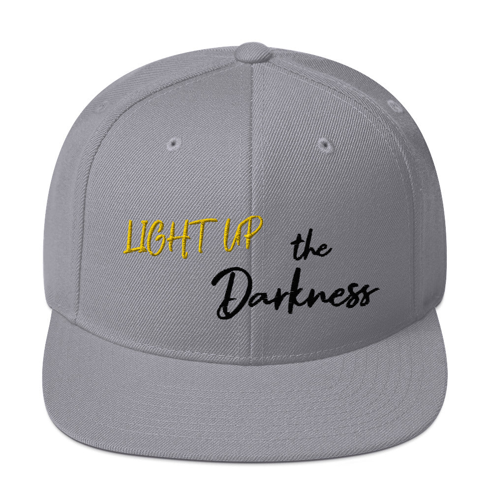 Light up the Darkness Snapback Hat (black lettering)